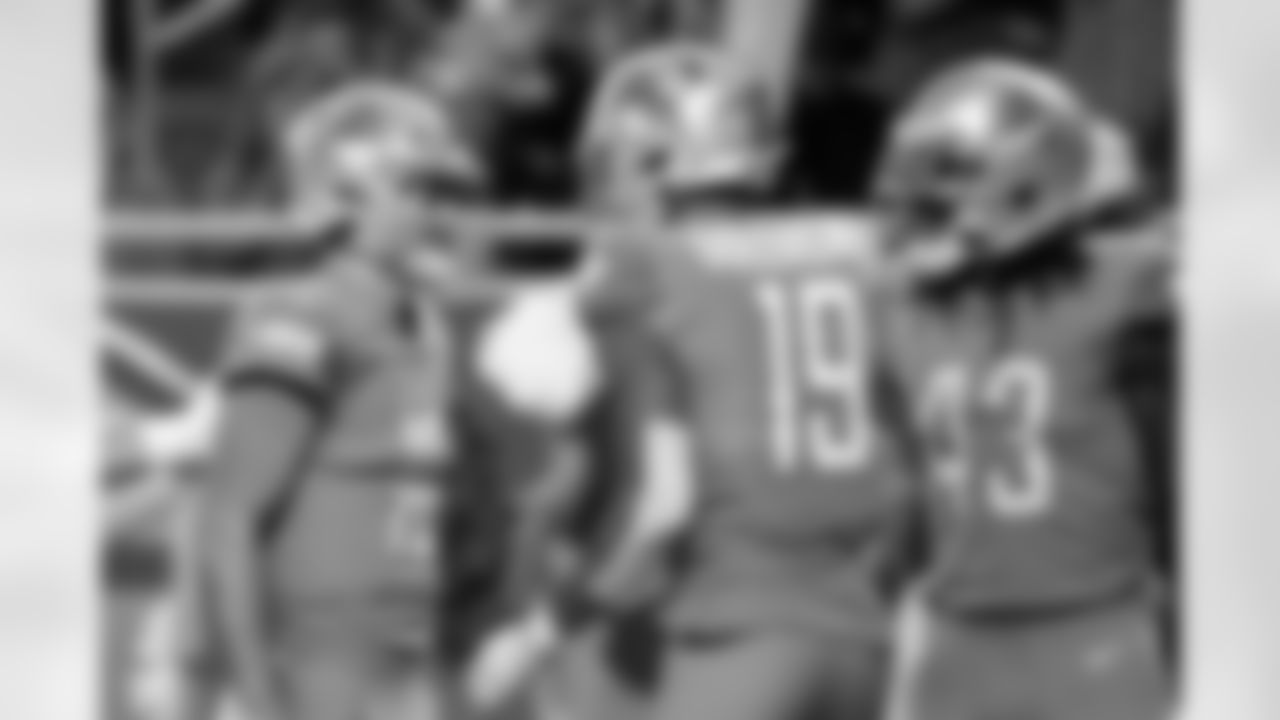 Detroit Lions quarterback David Blough (10) talks with wide receiver Kenny Golladay (19) after connecting with Golladay on a touchdown during the first half of an NFL football game against the Chicago Bears, Thursday, Nov. 28, 2019, in Detroit. (AP Photo/Paul Sancya)