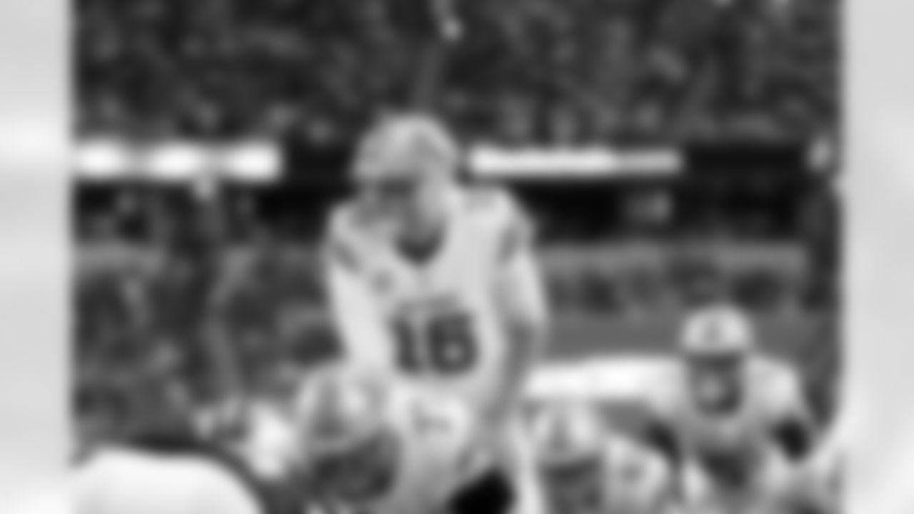 Detroit Lions quarterback Jared Goff (16) lines up behind center Frank Ragnow (77) during an NFL football game against the Dallas Cowboys on Sunday, Oct. 13, 2024, in Arlington, Texas. (AP Photo/Matt Patterson)