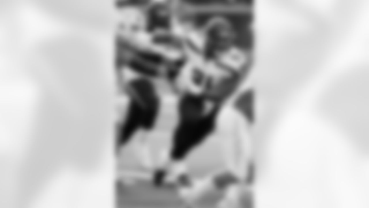 Seattle Seahawks defensive tackle Byron Murphy II (91) breaks free of a block by Los Angeles Chargers offensive tackle Foster Sarell (73) as he chases the action during an NFL football game, Saturday, Aug. 10, 2024 in Inglewood, Calif. The Seahawks defeated the Chargers 16-3. (Paul Spinelli via AP)