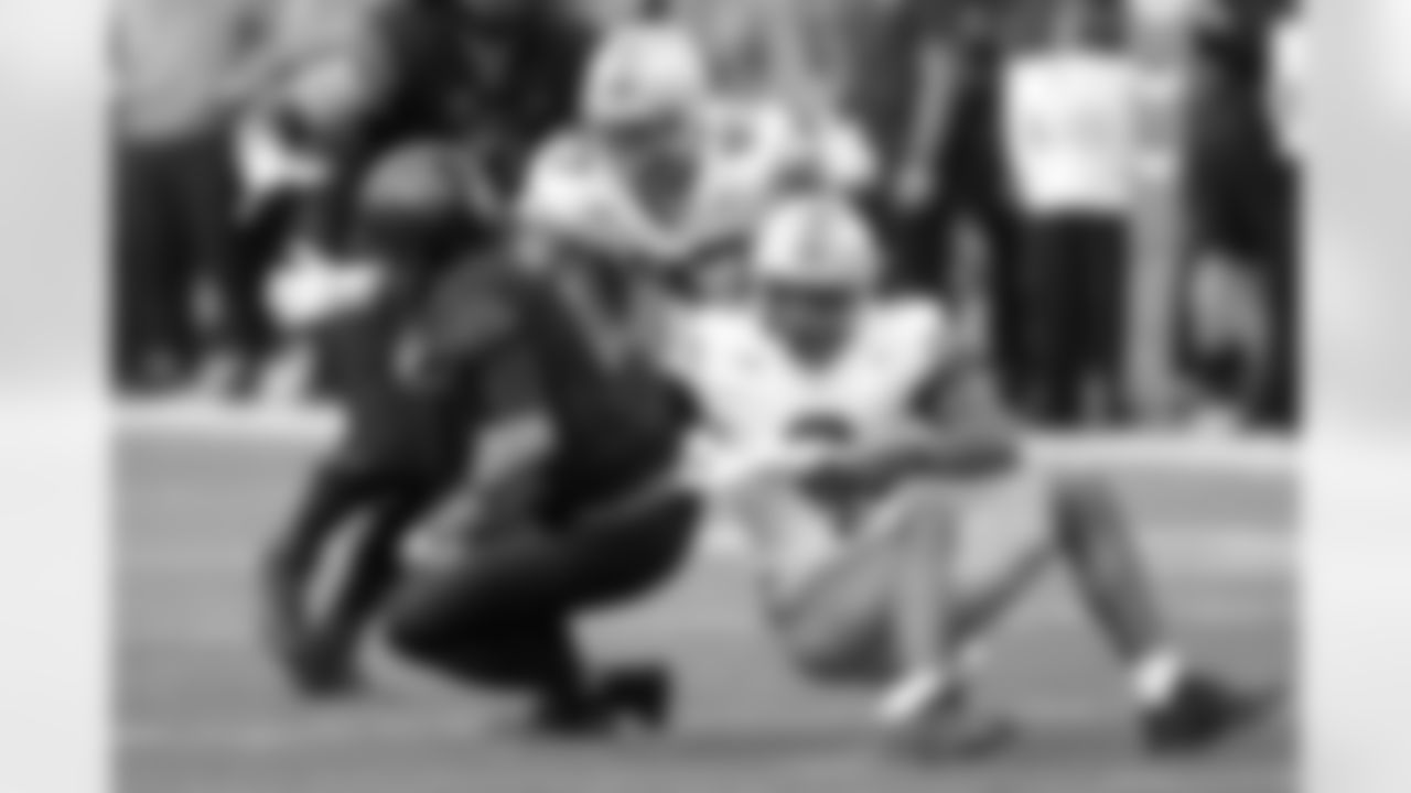 Ohio State safety Sonny Styles (6) and defensive end Kenyatta Jackson Jr. sack Northwestern quarterback Jack Lausch during the second half of an NCAA college football game at Wrigley Field on Saturday, Nov. 16, 2024, in Chicago. (AP Photo/Charles Rex Arbogast)