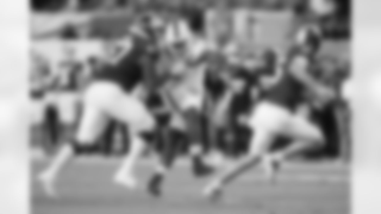 Indiana offensive lineman Kahlil Benson (67) defends against Miami defensive lineman Rueben Bain Jr. (4), center, as quarterback Fernando Mendoza (15) scrambles during the first half of a College Football Playoff national championship game, Monday, Jan. 19, 2026, in Miami Gardens, Fla. (AP Photo/Lynne Sladky)