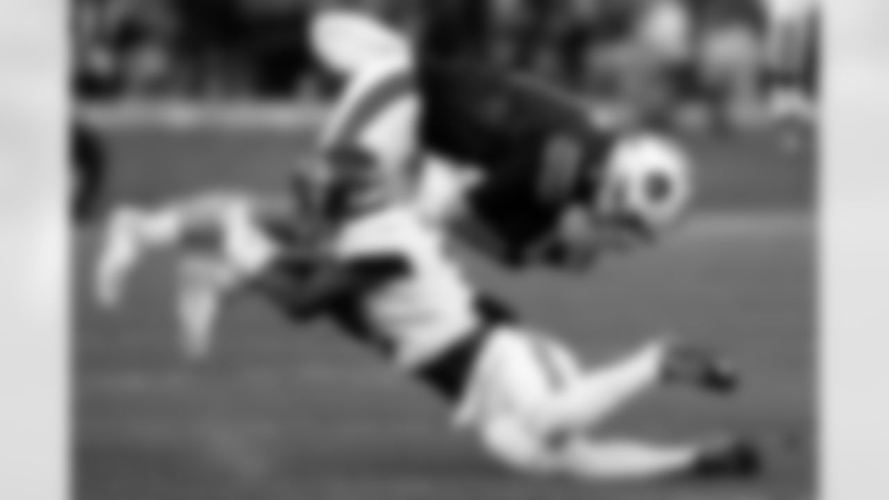 Auburn quarterback Payton Thorne (1) is tackled by Alabama defensive back Caleb Downs (2) as he carries the ball during the first half of an NCAA college football game Saturday, Nov. 25, 2023, in Auburn, Ala. (AP Photo/Butch Dill)