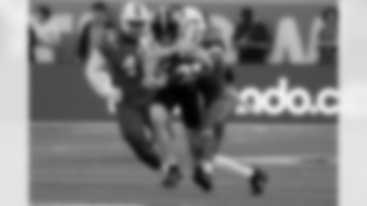 Iowa State wide receiver Eli Green, center, runs after a reception before he is tackled by Miami defensive lineman Rueben Bain Jr. (4) and linebacker Cam Pruitt, right, during the first half of the Pop Tarts Bowl NCAA college football game, Saturday, Dec. 28, 2024, in Orlando, Fla. (AP Photo/John Raoux)