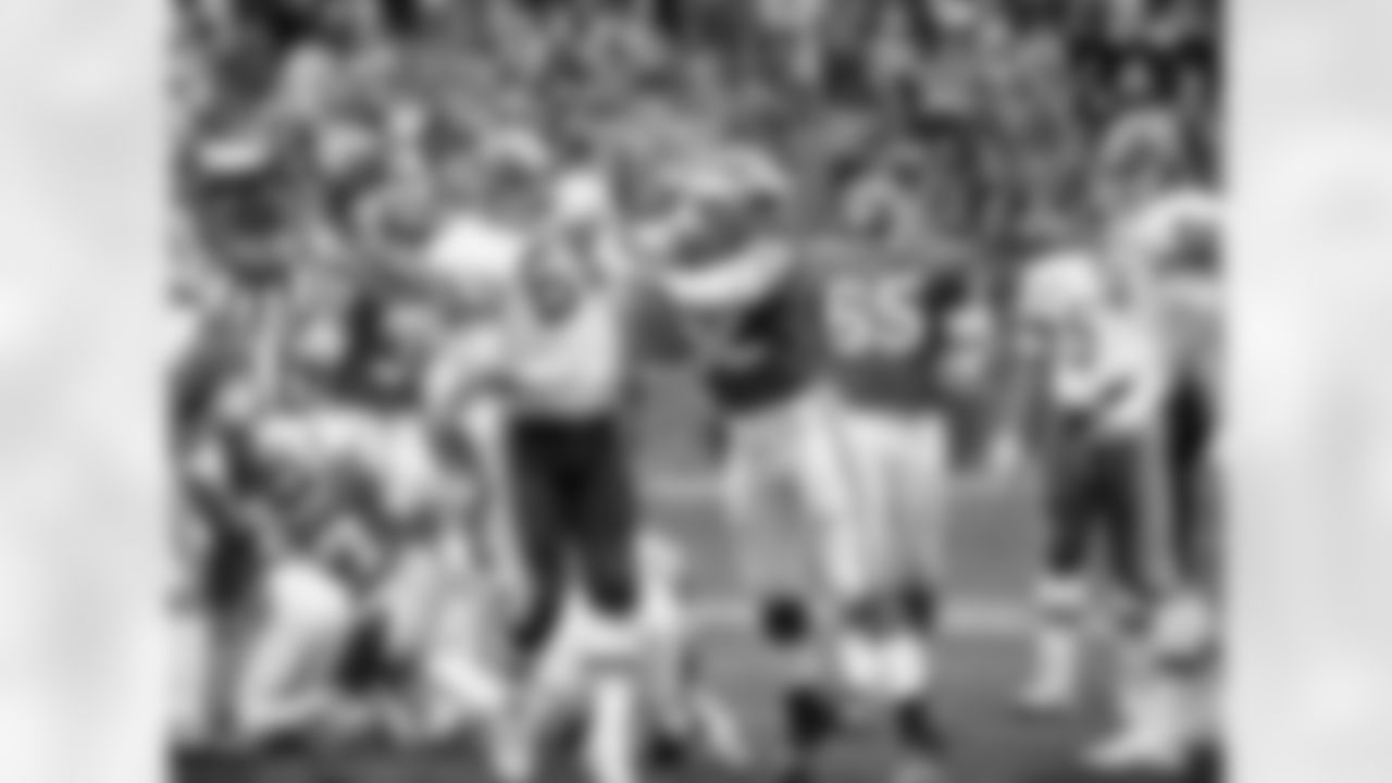 * FILE * In this Jan. 15, 1983, file photo, Washington Redskins' Russ Grimm (68) and Minnesota Vikings' Dennis Johnson (52) scuffle during an NFL football playoff game in Washington. Arizona's nine-day stay in the D.C. area between games against the Washington Redskins and the New York Jets puts Arizona offensive line coach Grimm back in the city where he won three Super Bowls and began his coaching career. (AP Photo/File)