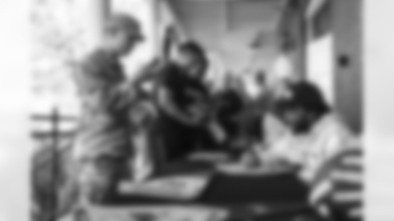 Images of Commander players and Command Force visiting Arlington National Cemetery with the USAA event staff at Fort Myers on October 21, 2025 in Landover, MD (Photo by Taylor Sims for Washington Commanders)