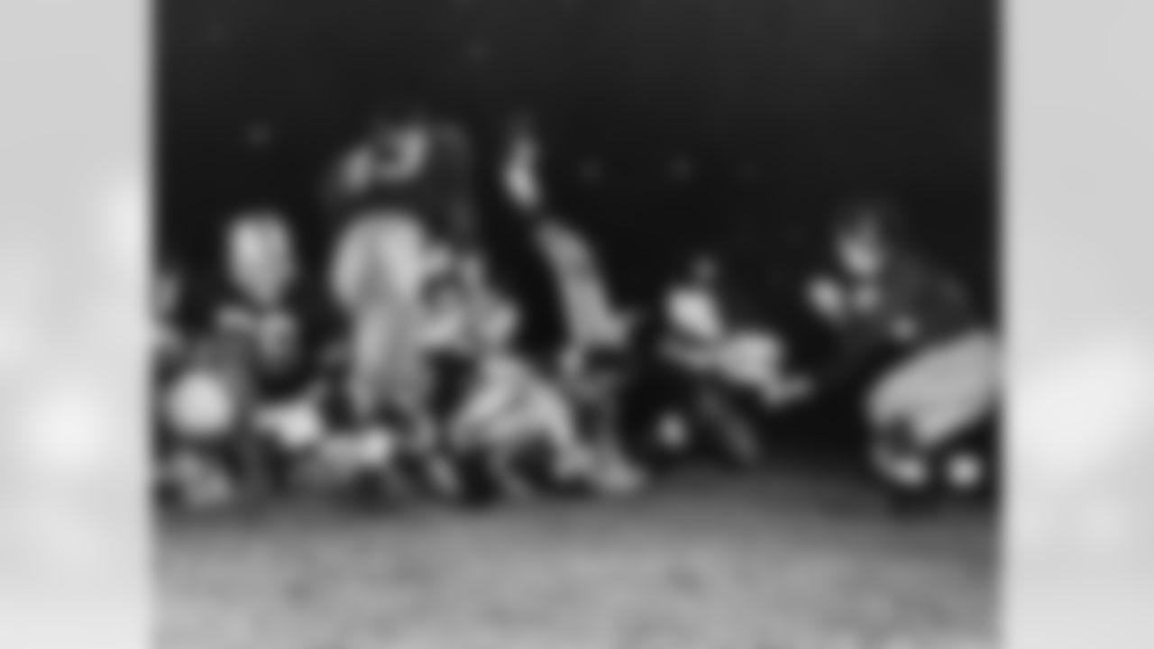 Pittsburgh Steelers halfback Johnny Lattner (41) falls into the end zone as guard John Schweder (66) throws a block during an NFL game against the Washington Redskins in Pittsburgh, Oct. 2, 1954. The Steelers defeated the Redskins 37-7. (AP Photo/Pro Football Hall of Fame)