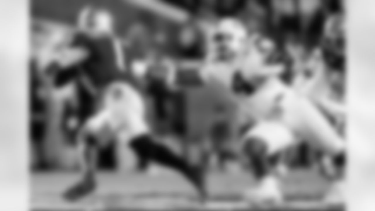 Miami defensive lineman Rueben Bain Jr. (4) tries to grab Florida State quarterback Tommy Castellanos (1) during the first half of an NCAA college football game, Saturday, Oct. 4, 2025, in Tallahassee, Fla. (AP Photo/Colin Hackley)