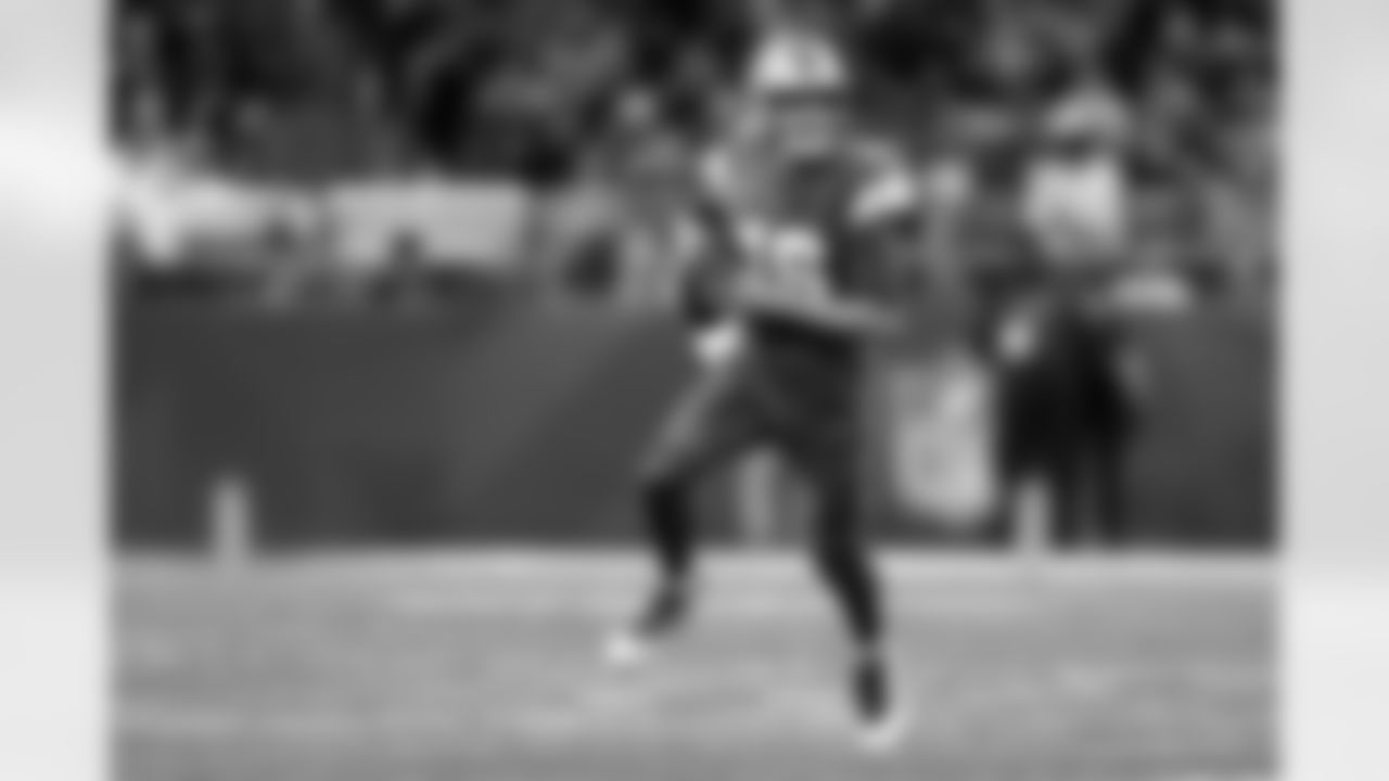 Detroit Lions quarterback Jared Goff (16) scrambles out of the pocket during an NFL football game against the Green Bay Packers, Thursday, Dec. 5, 2024 in Detroit. (Kevin Sabitus via AP)