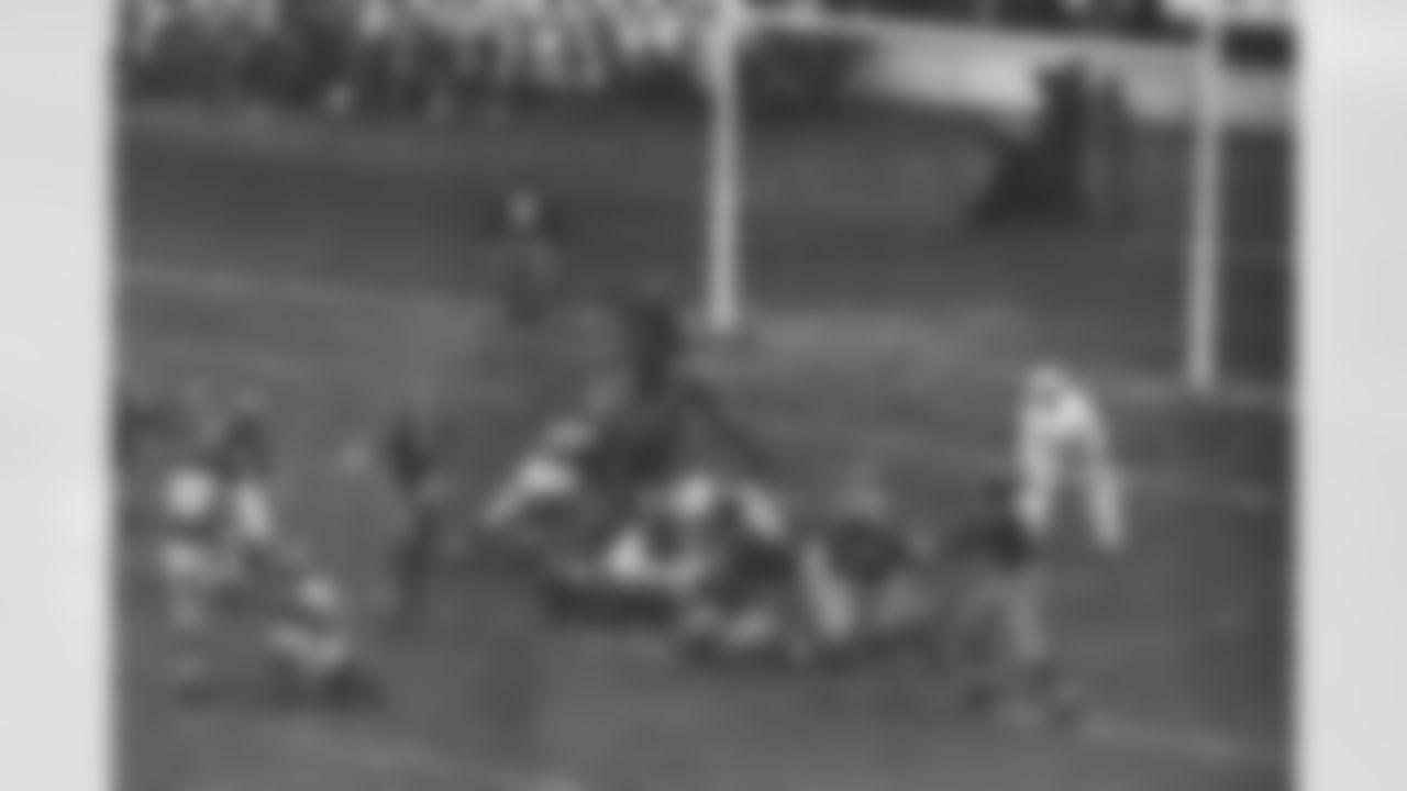 Ken Strong (30), kicking the 2nd of 3 field goals which scored for the New York Giants in their game against the Washington Redskins at the Polo Grounds in New York City, Dec. 3, 1939. The Giants Won 9-7. The ball is in the air just above Frank Filchock (30) of Redskins. The victory gave the Giants the Eastern Division Championship of the National Football League for the 2nd consecutive year. Redskins shown are Jim Barber (15) and Steve Slivinski (16). Giants are Tuffy Leemans (4), John "Bull" Karcis (11); Ed Widseth (50) and Nello "Flash" Falaschi (28). (AP Photo)