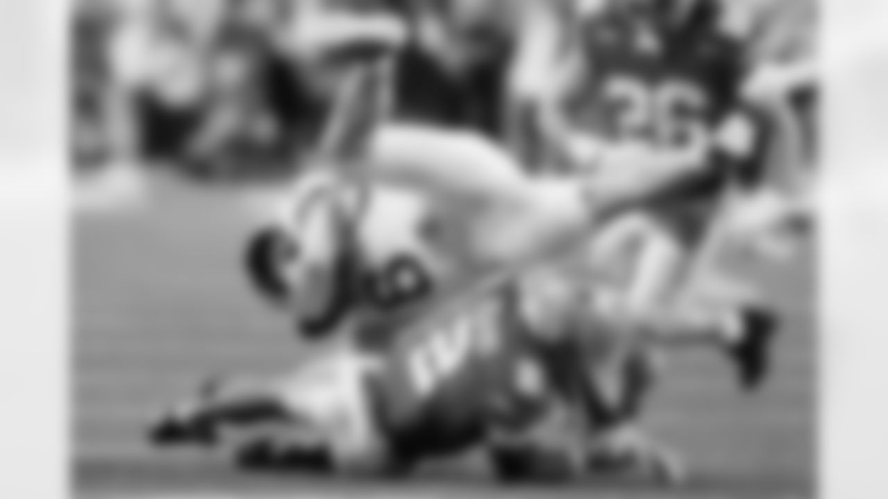 Ohio State defensive back Caleb Downs, bottom, tackles Ohio running back Adonis Williams during the second half of an NCAA college football game, Saturday, Sept. 13, 2025, in Columbus, Ohio. (AP Photo/Jay LaPrete)