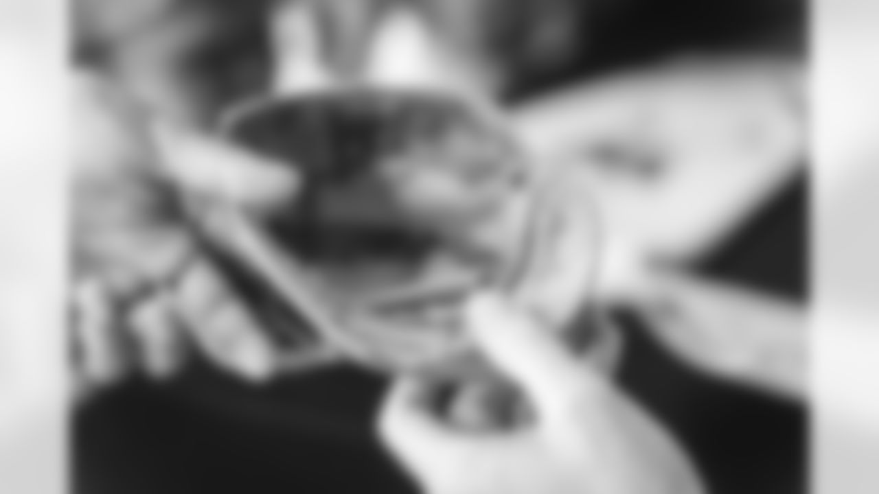 Images of Commander players and Command Force visiting Arlington National Cemetery with the USAA event staff at Fort Myers on October 21, 2025 in Landover, MD (Photo by Taylor Sims for Washington Commanders)