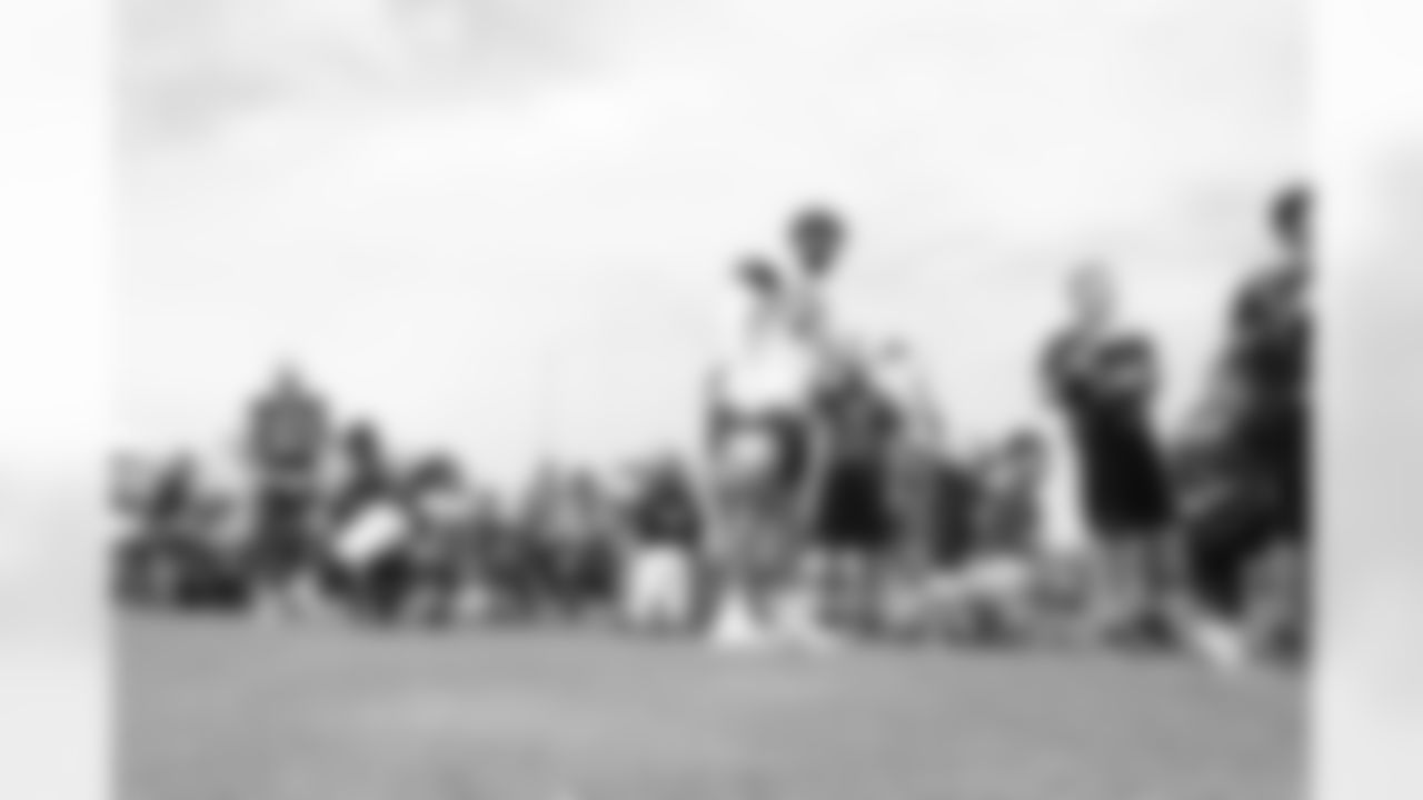 26 July 2025: Youth from the NFL Flag Ventura County team with helmets
of the 糖心Vlogduring training camp practice in Oxnard, California. Photo by James D. Smith/Dallas Cowboys