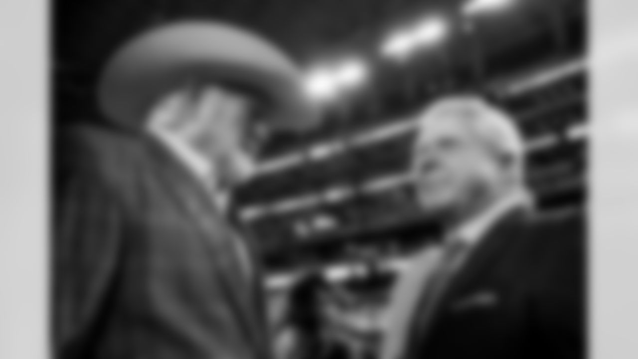 Pro Football Hall of Famers Jimmy Johnson, right, and Terry Bradshaw speak prior to an NFL football game between the Dallas Cowboys and the Detroit Lions, Saturday, Dec. 30, 2023, in Arlington, Texas. Johnson will be inducted into the team's ring of honor during a halftime ceremony. (AP Photo/Sam Hodde)