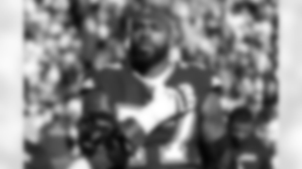 Dallas Cowboys offensive tackle Tyron Smith (77) stands on the sideline before an NFL football game against the Washington Football Team, Sunday, Dec. 12, 2021, in Landover, Md. The Cowboys defeated Washington, 27-20. (James D. Smith via AP)