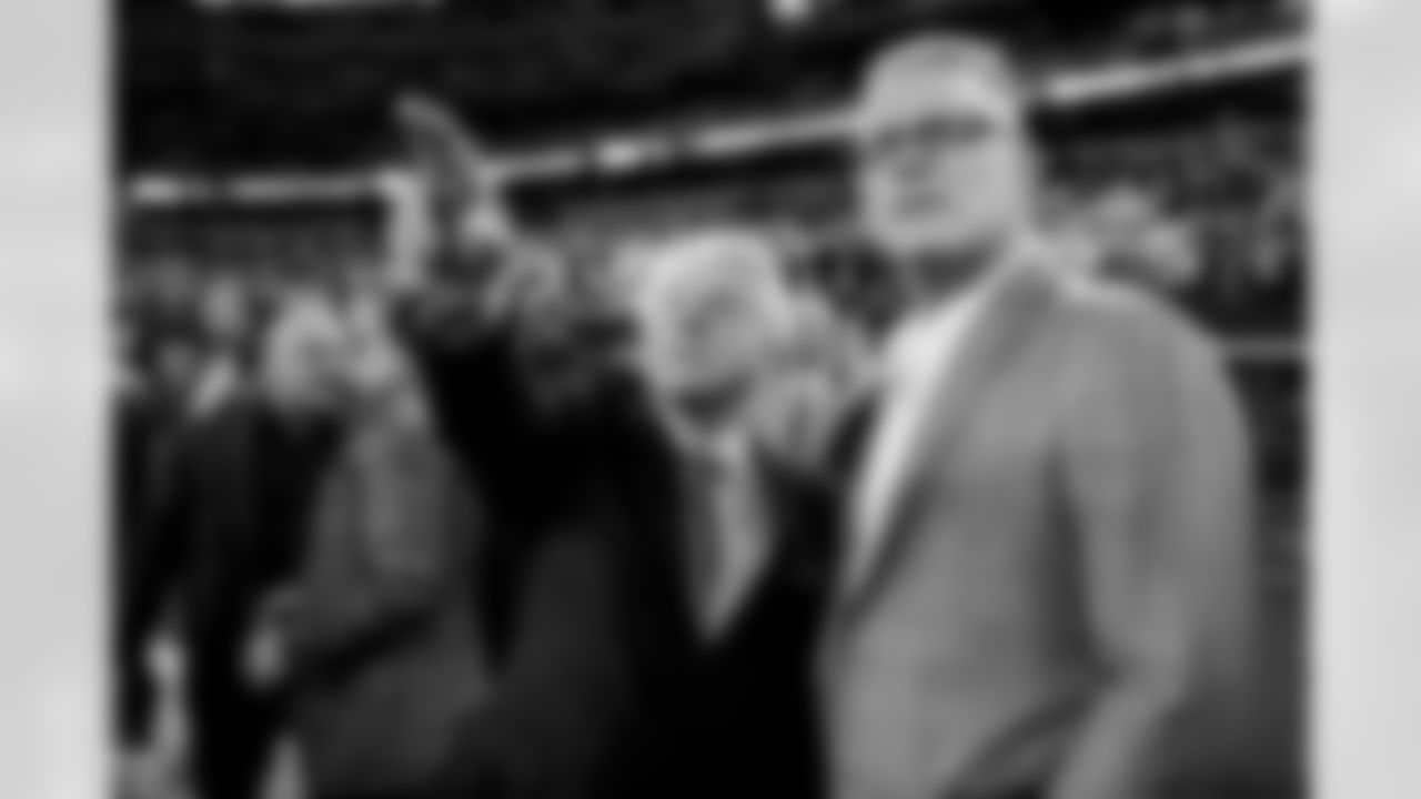 Pro Football Hall of Fame coach Jimmy Johnson, left, talks with former NFL player Howie Long prior to an NFL football game between the Dallas Cowboys and the Detroit Lions, Saturday, Dec. 30, 2023, in Arlington, Texas. Johnson will be inducted into the team's ring of honor during a halftime ceremony. (AP Photo/Sam Hodde)