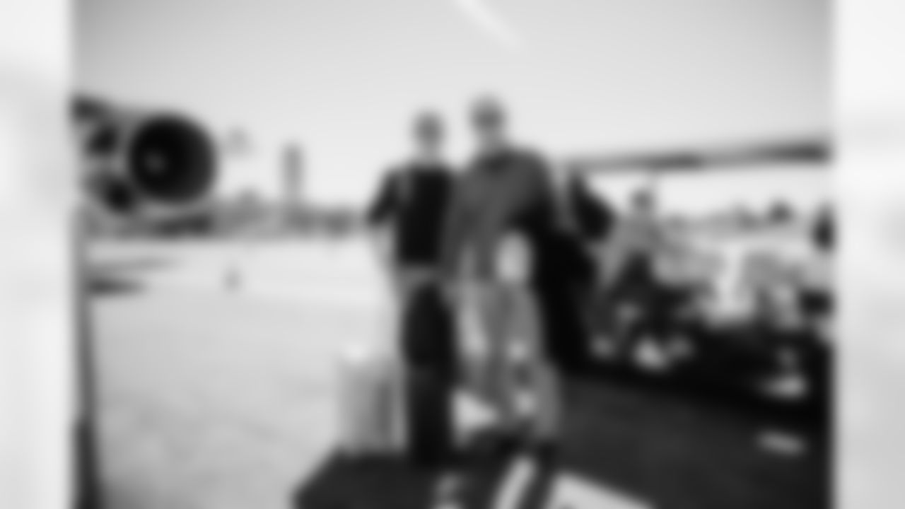 Miami Dolphins President and CEO Tom Garfinkel and son during arrivals to the plane for travel to Boston on Saturday, Jan. 3, 2026, in Fort Lauderdale, Fla. (Tomas Diniz Santos/Miami Dolphins)