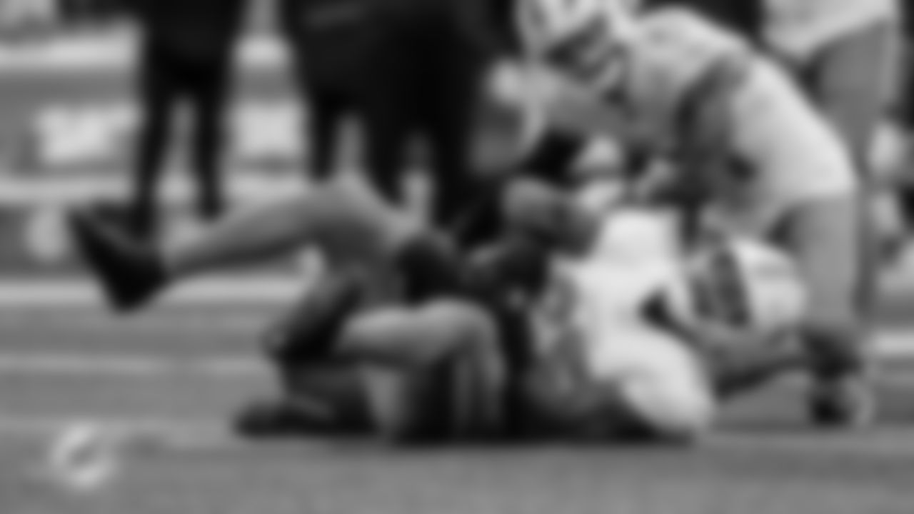 Miami Dolphins linebacker Tyrel Dodson (25) catches an interception between his knees during an NFL football game against the New York Jets on Sunday, Dec. 7, 2025 in East Rutherford, NJ. (Tomas Diniz Santos/Miami Dolphins via AP)