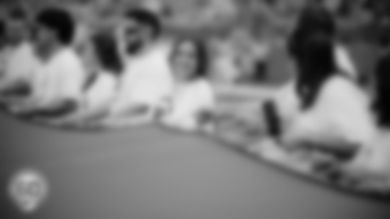 Miami Dolphins fans hold the American Flag during the National Anthem before an NFL football game against the Cincinnati Bengals on Sunday, Dec. 21, 2025 in Miami Gardens, FL. (Raul Maristany/Miami Dolphins via AP)