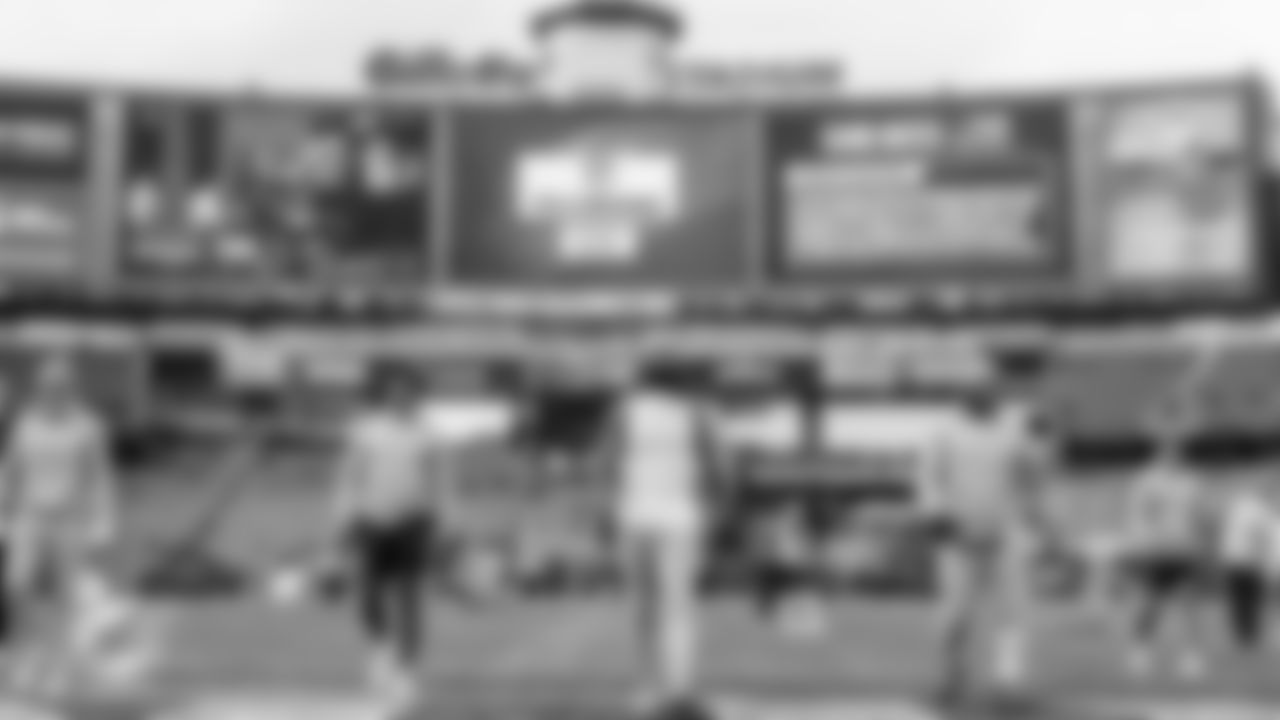Miami Dolphins cornerbacks Ethan Bonner (27) and Jason Marshall Jr. (33), wide receiver Theo Wease Jr. (81) and linebacker K.J. Britt (3) warm up before an NFL football game against the New England Patriots on Sunday, Jan. 4, 2026 in Foxborough, MA. (Ryan Lee/Miami Dolphins via AP)