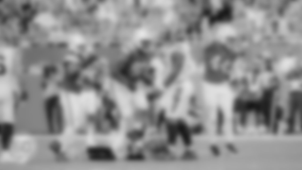 Miami Dolphins defensive tackle Kenneth Grant (90) and linebacker Chop Robinson (44) sack Cincinnati Bengals quarterback Joe Burrow (9) during an NFL football game on Sunday, Dec. 21, 2025 in Miami Gardens, FL. (Carlos Goldman/Miami Dolphins via AP)