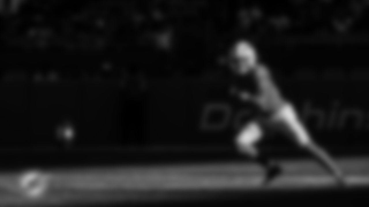 Miami Dolphins safety Ashtyn Davis (21) recovers a fumble during an NFL football game against the Tampa Bay Buccaneers on Sunday, Dec. 28, 2025 in Miami Gardens, FL. (Ruben Gonzalez/Miami Dolphins via AP)