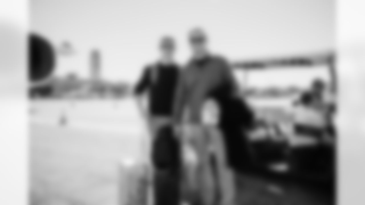 Miami Dolphins President and CEO Tom Garfinkel and son during arrivals to the plane for travel to Boston on Saturday, Jan. 3, 2026, in Fort Lauderdale, Fla. (Tomas Diniz Santos/Miami Dolphins)