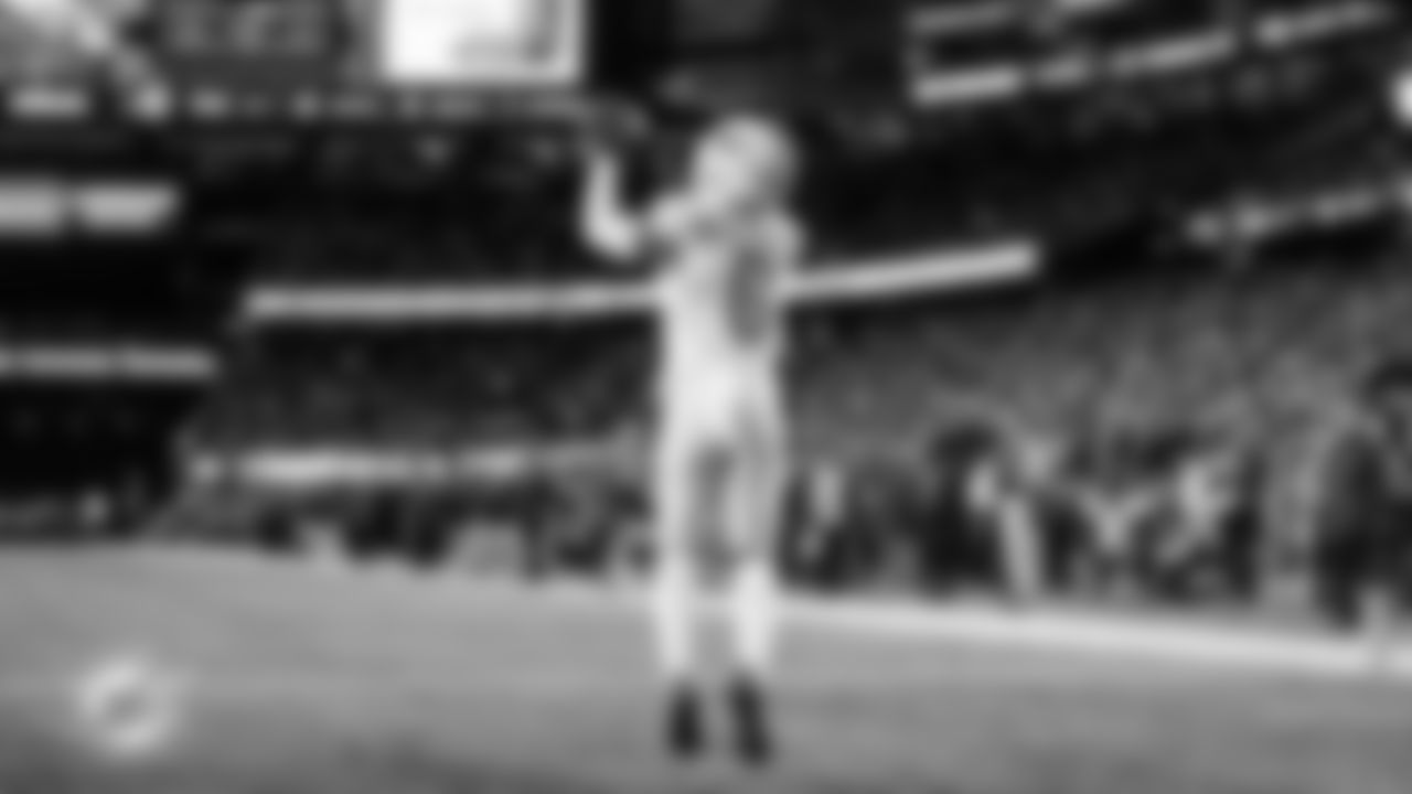 Miami Dolphins wide receiver Malik Washington (6) makes a catch in the end zone for a touchdown during an NFL football game against the New England Patriots on Sunday, Jan. 4, 2026 in Foxborough, Mass. (Ryan Lee/Miami Dolphins via AP)