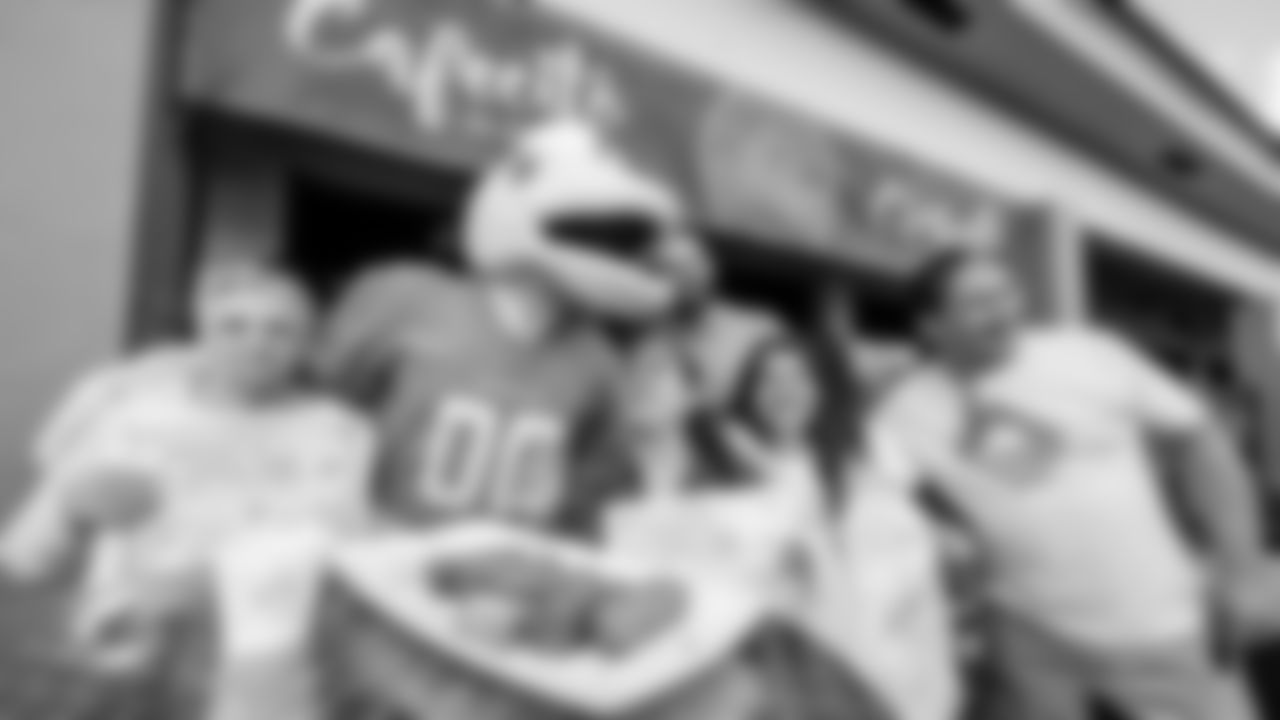 TD poses with fans and food outside Islas Canarias.