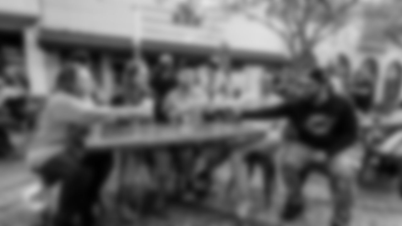 Fans in Dolphins gear gather for a drink at The Bar.