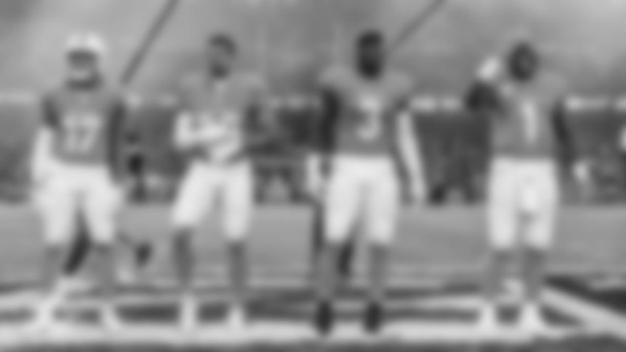 Miami Dolphins wide receiver Jaylen Waddle (17), safety Minkah Fitzpatrick (29), linebacker K.J. Britt (3) and quarterback Tua Tagovailoa (1) walk onto the field for the coin toss before an NFL football game against the Washington Commanders on Sunday, Nov. 16, 2025 in Madrid. (Tomas Diniz Santos/Miami Dolphins via AP)