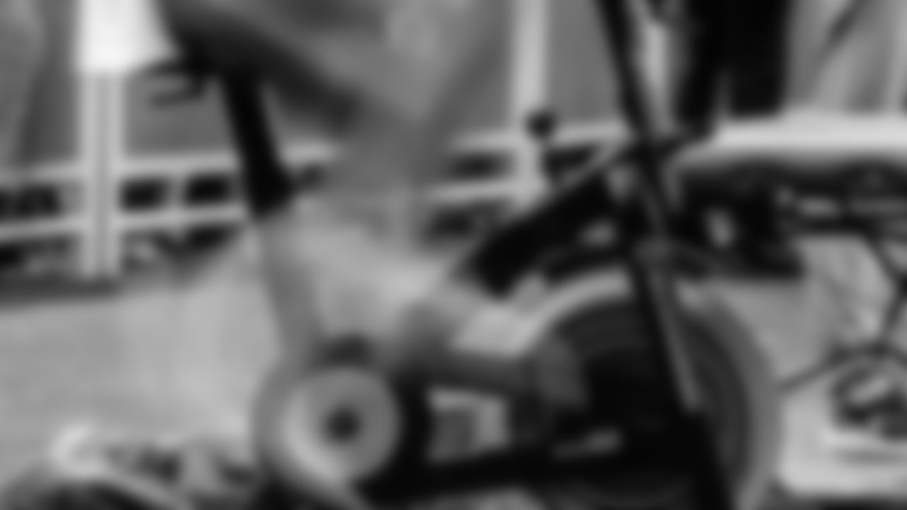 A Miami Dolphins player rides a stationary bike during an NFL football game against the Atlanta Falcons on Sunday, Oct. 26, 2025 in Atlanta, GA. (Tomas Diniz Santos/Miami Dolphins via AP)