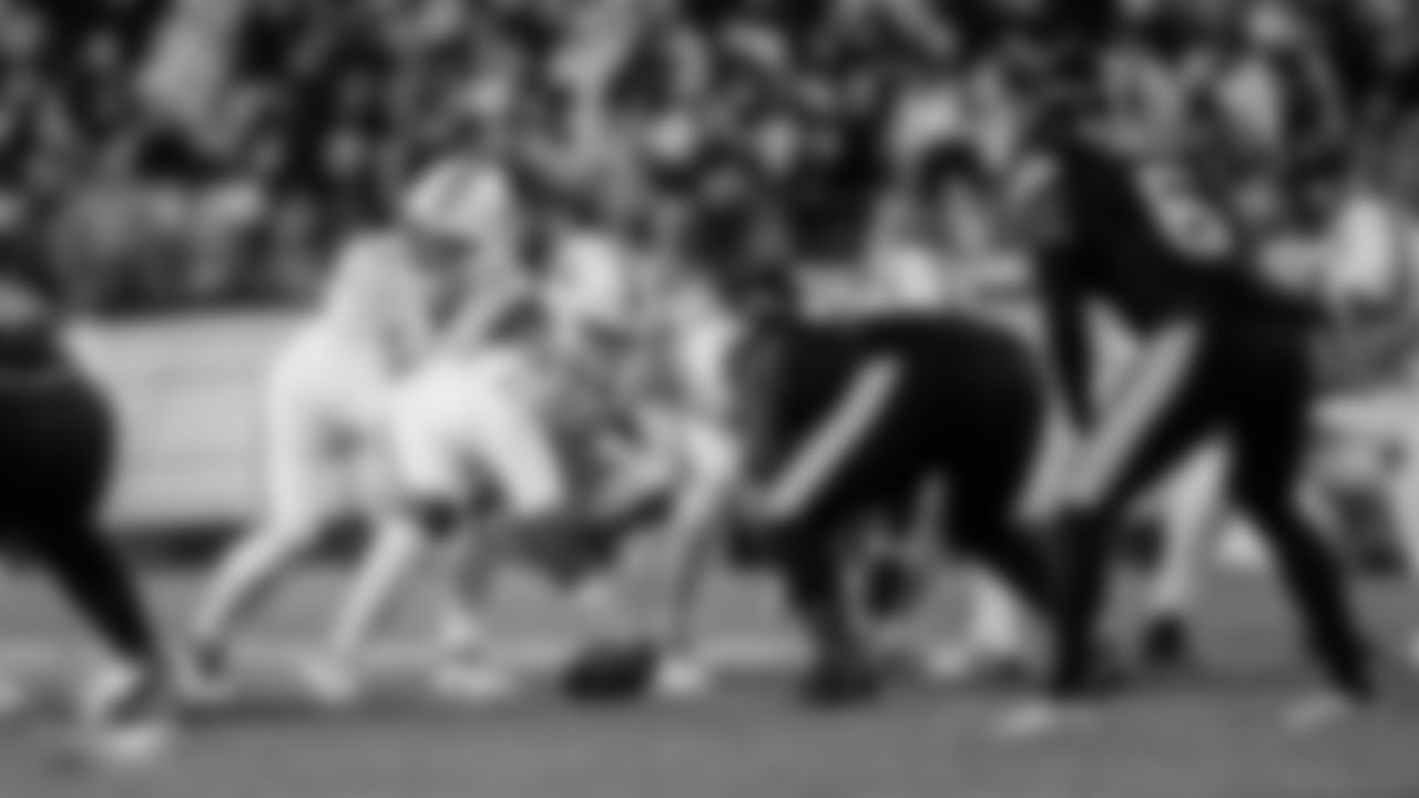 Miami Dolphins quarterback Tua Tagovailoa (1) and offensive lineman Aaron Brewer (55) set at the line of scrimmage during an NFL football game against the Pittsburgh Steelers on Monday, Dec. 15, 2025 in Pittsburgh, PA. (Tomas Diniz Santos/Miami Dolphins via AP)