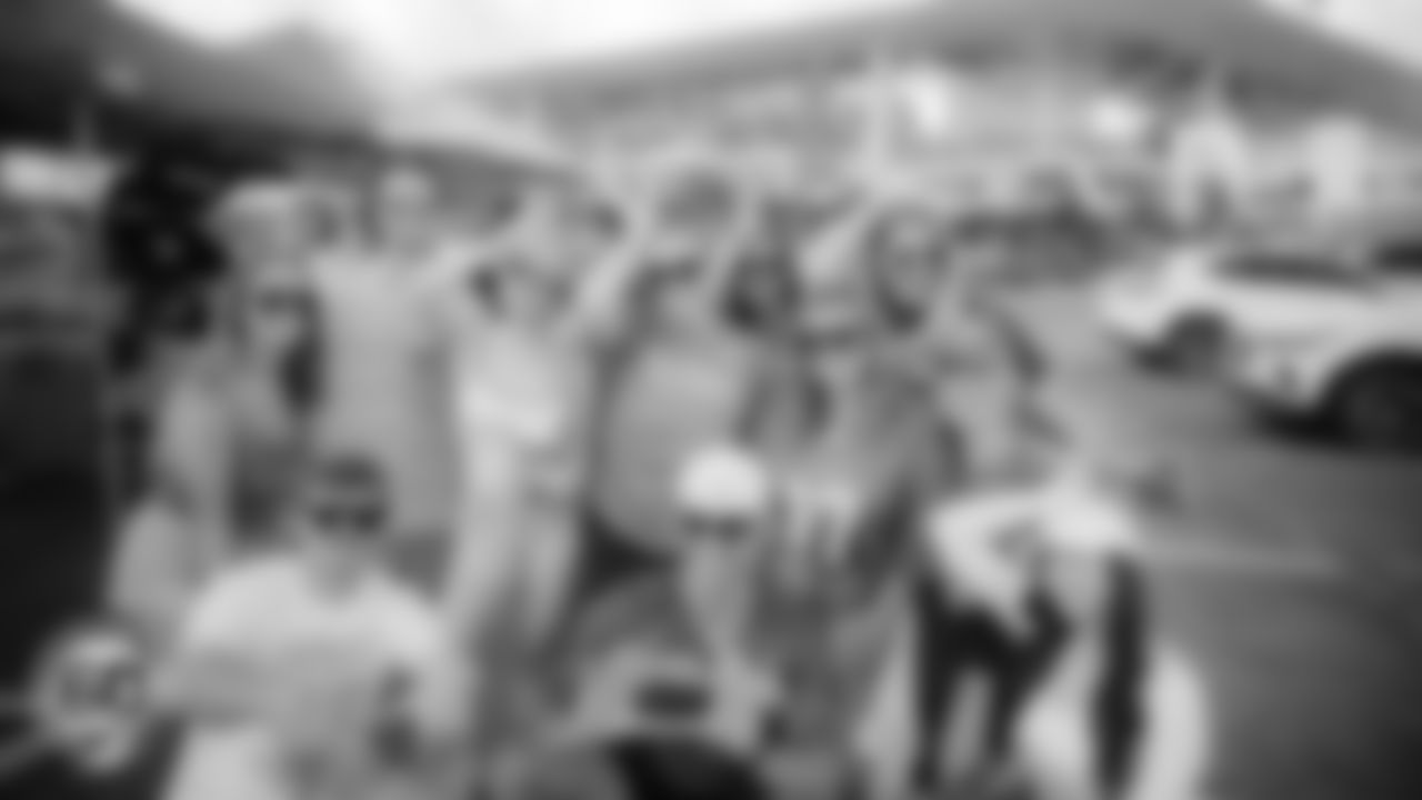 Miami Dolphins fans pose before an NFL football game against the Cincinnati Bengals on Sunday, Dec. 21, 2025 in Miami Gardens, FL. (AJ Shorter/Miami Dolphins via AP)