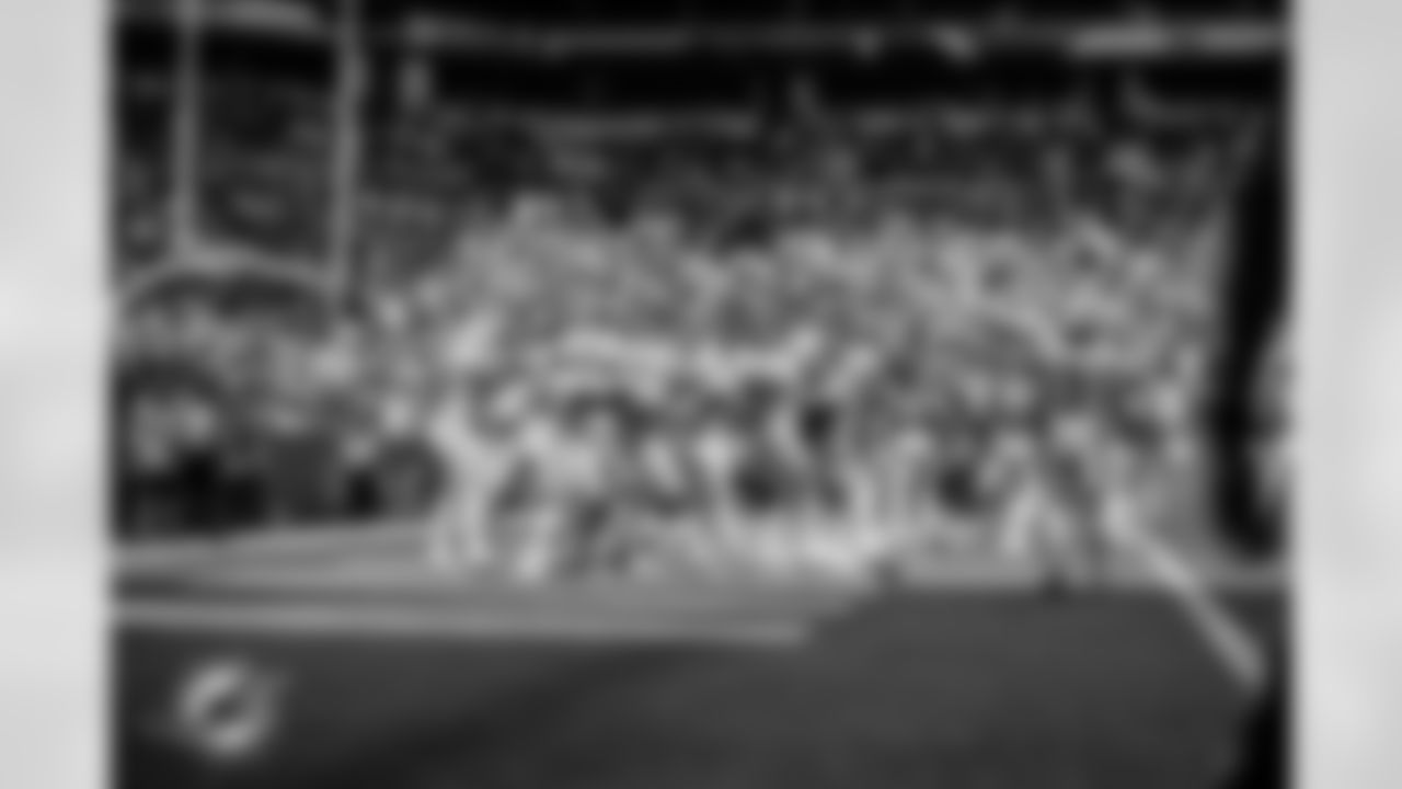 ÅÝܽÊÓÆµ Dolphins tight end Julian Hill (89), guard/tackle Robert Hunt (68), tackle Isaiah Wynn (77), wide receiver Tyreek Hill (10), runningback Raheem Mostert (31), tackle Terron Armstead (72) and quarterback Tua Tagovailoa (1) celebrate during an NFL football game against the Denver Broncos, Sunday, Sept. 24, 2023 in ÅÝܽÊÓÆµ Gardens, Fla. (Brennan Asplen/ÅÝܽÊÓÆµ Dolphins)