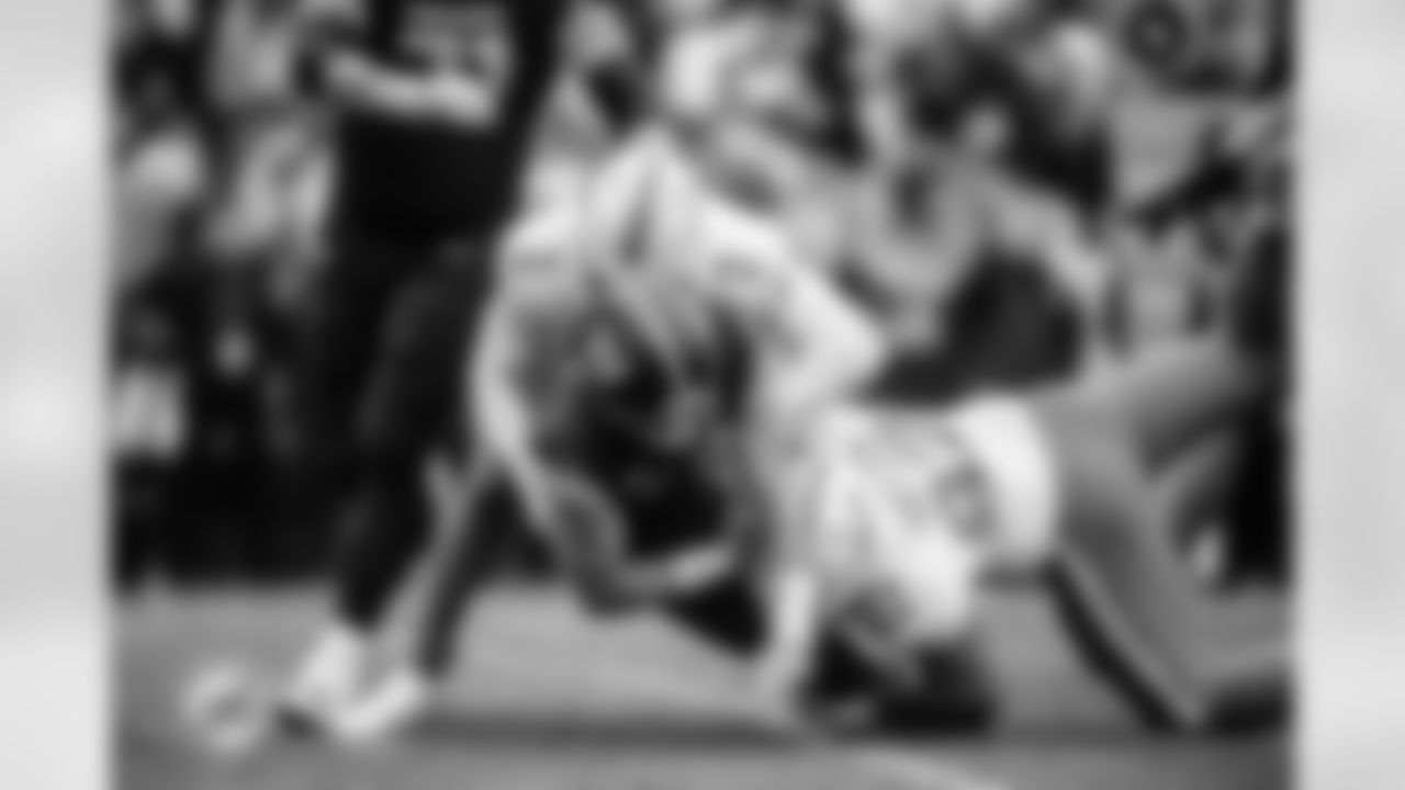 ÅÝܽÊÓÆµ Dolphins linebacker Bradley Chubb (2) and defensive tackle Zach Sieler (92) sack Washington Commanders quarterback Sam Howell (14) during an NFL football game, Sunday, Dec. 3, 2023 in Landover, Md. (Peter McMahon/ÅÝܽÊÓÆµ Dolphins)