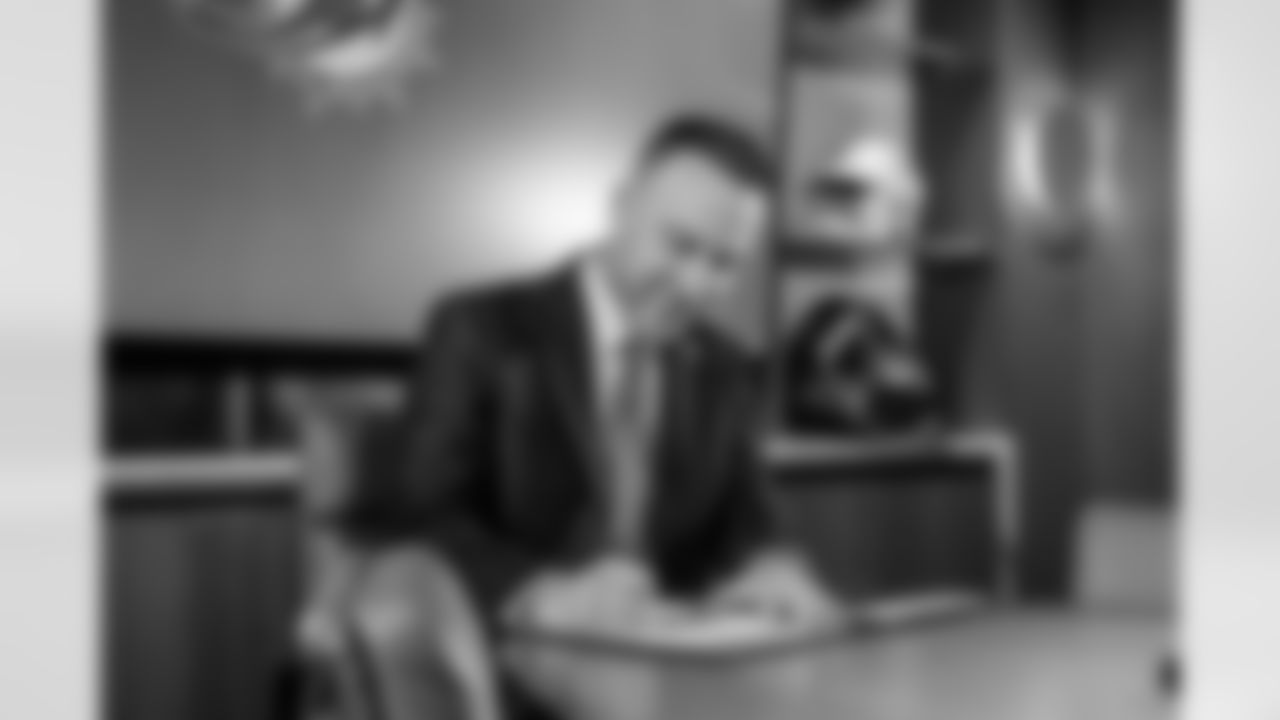 Miami Dolphins new head coach Jeff Hafley signs his contract at the Baptist Health Training Facility on Thursday, Jan. 22, 2026, in Miami Gardens, Fla. (Peter McMahon/Miami Dolphins)