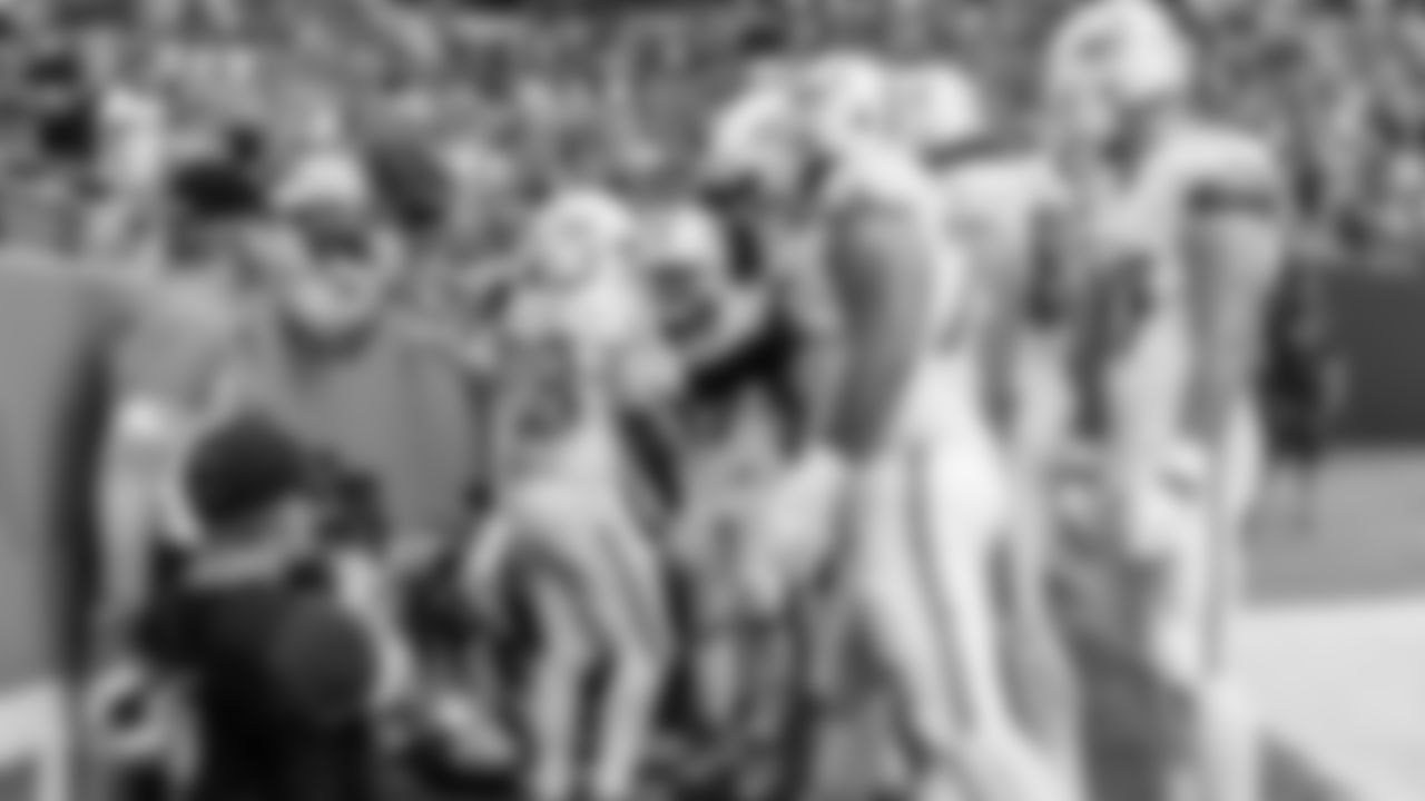 Miami Dolphins running back De'Von Achane (28) celebrates a touchdown with fans during an NFL football game against the Buffalo Bills on Sunday, Nov. 9, 2025 in Miami Gardens, Fla. (Robby Illanes/Miami Dolphins via AP)