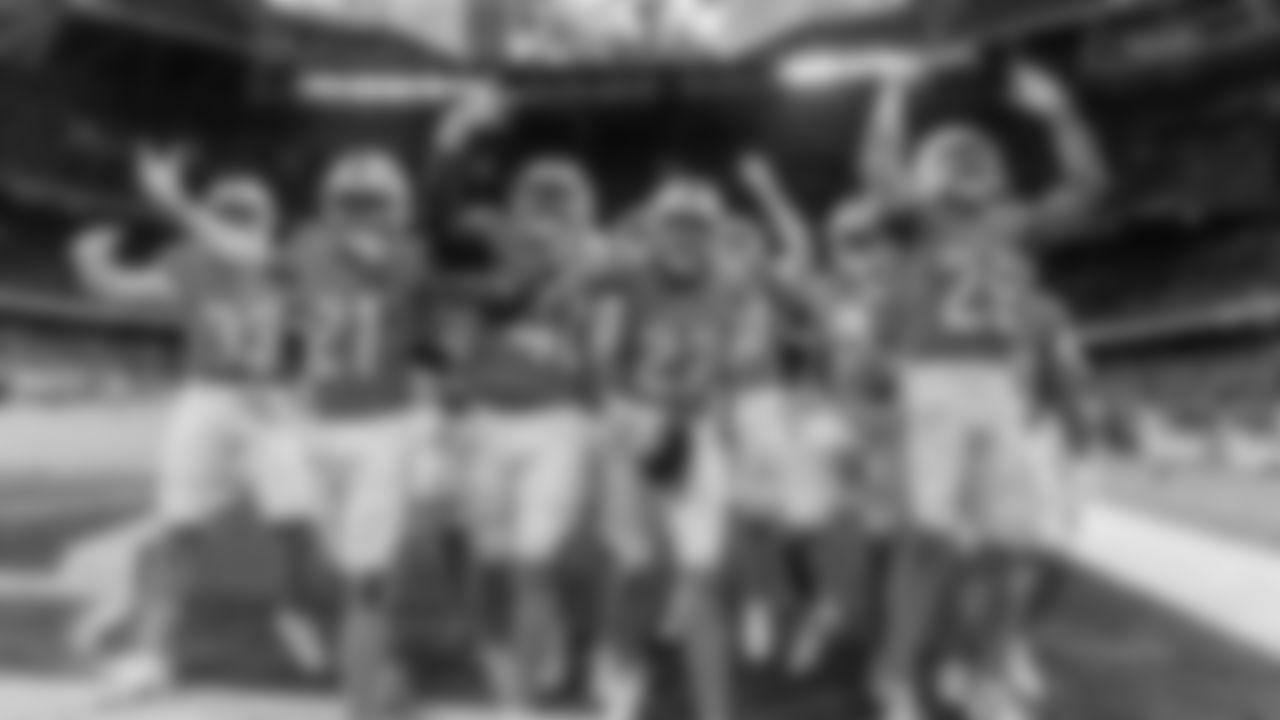 Miami Dolphins celebrate a fumble recovery by cornerback Ethan Bonner (27) during an NFL football game against the Washington Commanders on Sunday, Nov. 16, 2025 in Madrid. (Tomas Diniz Santos/Miami Dolphins via AP)