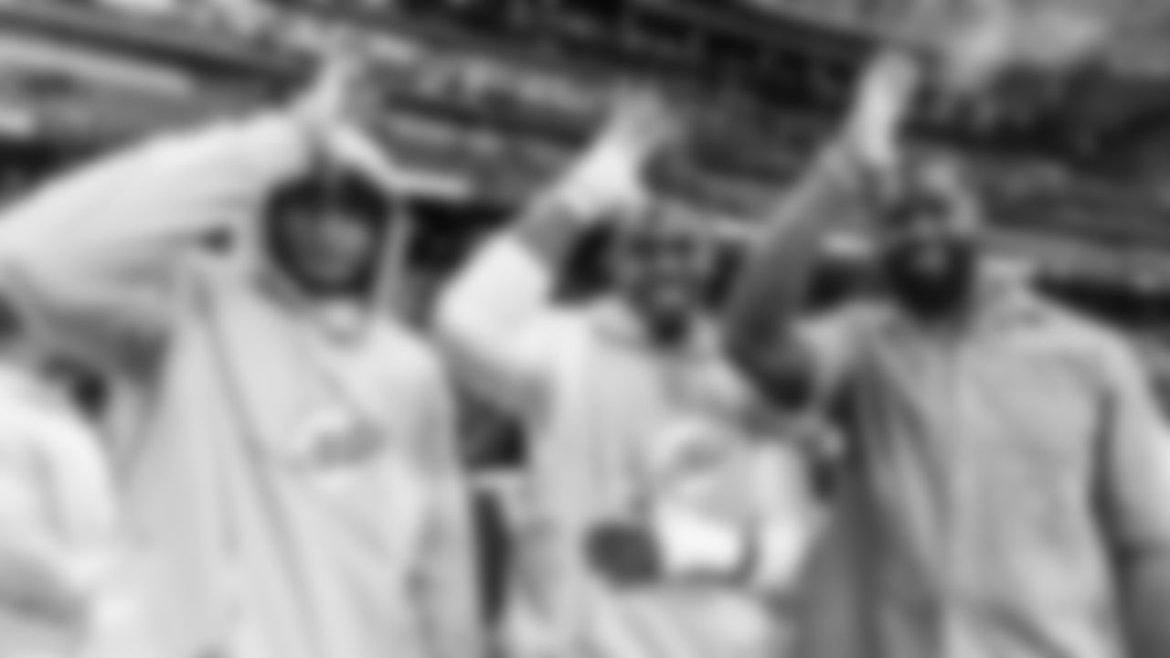 Miami Dolphins offensive tackle Austin Jackson (73), offensive lineman Aaron Brewer (55) and alum Terron Armstead (72) pose and put their fins up before an NFL football game against the Washington Commanders on Sunday, Nov. 16, 2025 in Madrid. (Tomas Diniz Santos/Miami Dolphins via AP)