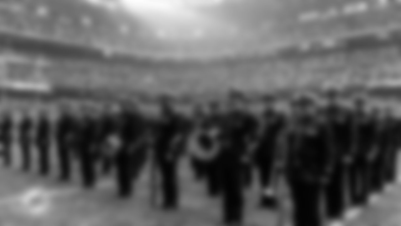 Color guard stands for the National Anthem before an NFL football game between the Miami Dolphins and Washington Commanders on Sunday, Nov. 16, 2025 in Madrid. (Tomas Diniz Santos/Miami Dolphins via AP)