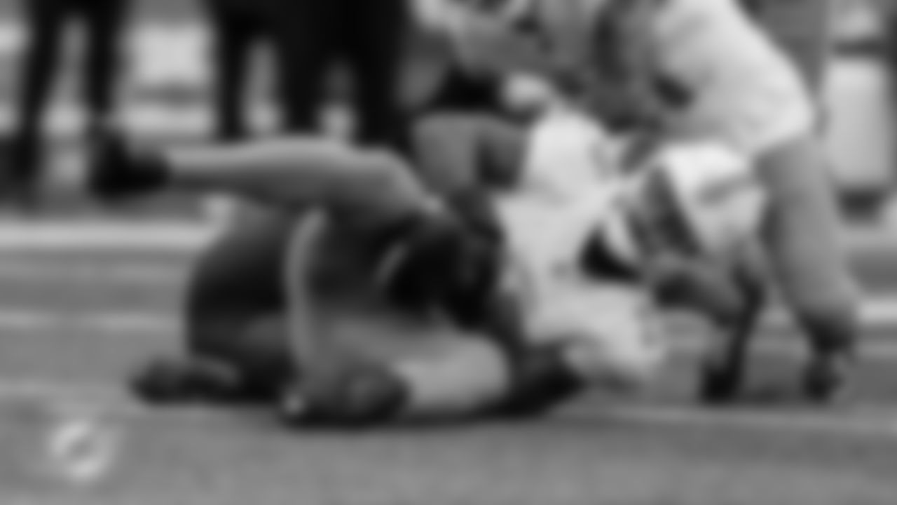 Miami Dolphins linebacker Tyrel Dodson (25) catches an interception between his knees during an NFL football game against the New York Jets on Sunday, Dec. 7, 2025 in East Rutherford, NJ. (Tomas Diniz Santos/Miami Dolphins via AP)