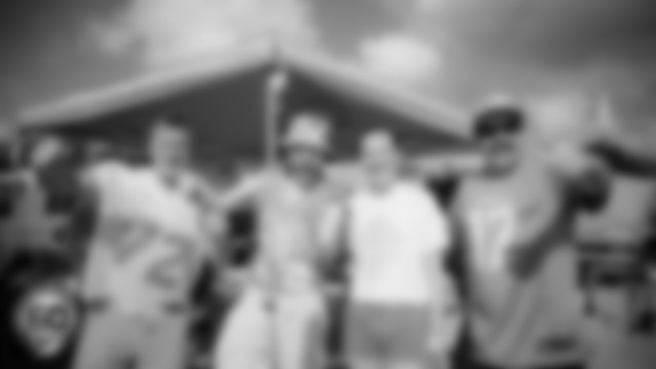 Miami Dolphins fans pose before an NFL football game against the Cincinnati Bengals on Sunday, Dec. 21, 2025 in Miami Gardens, FL. (AJ Shorter/Miami Dolphins via AP)