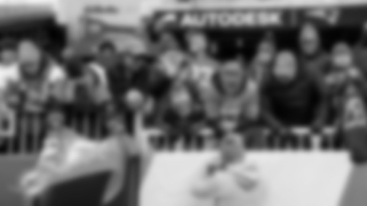 Miami Dolphins fans get autographs before an NFL football game against the New England Patriots on Sunday, Jan. 4, 2026 in Foxborough, MA. (Ryan Lee/Miami Dolphins via AP)