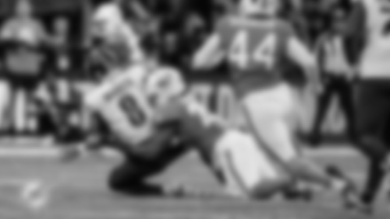 Miami Dolphins linebacker Tyrel Dodson (25) sacks Washington Commanders quarterback Marcus Mariota (8) during an NFL football game Sunday, Nov. 16, 2025 in Madrid. (Peter McMahon/Miami Dolphins via AP)