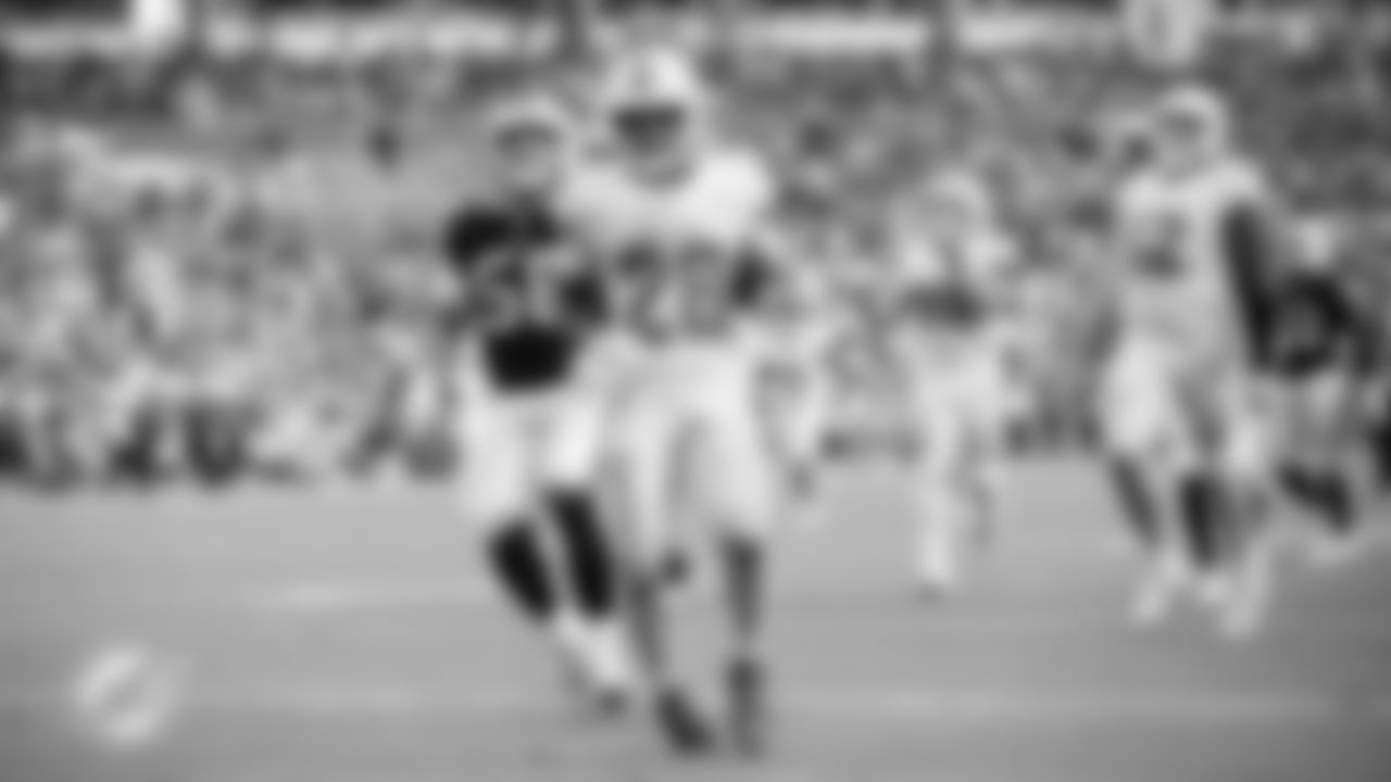 Miami Dolphins running back De'Von Achane (28) runs the ball into the end zone for a touchdown during an NFL football game against the Buffalo Bills on Sunday, Nov. 9, 2025 in Miami Gardens, Fla. (Jose Pineiro/Miami Dolphins via AP)