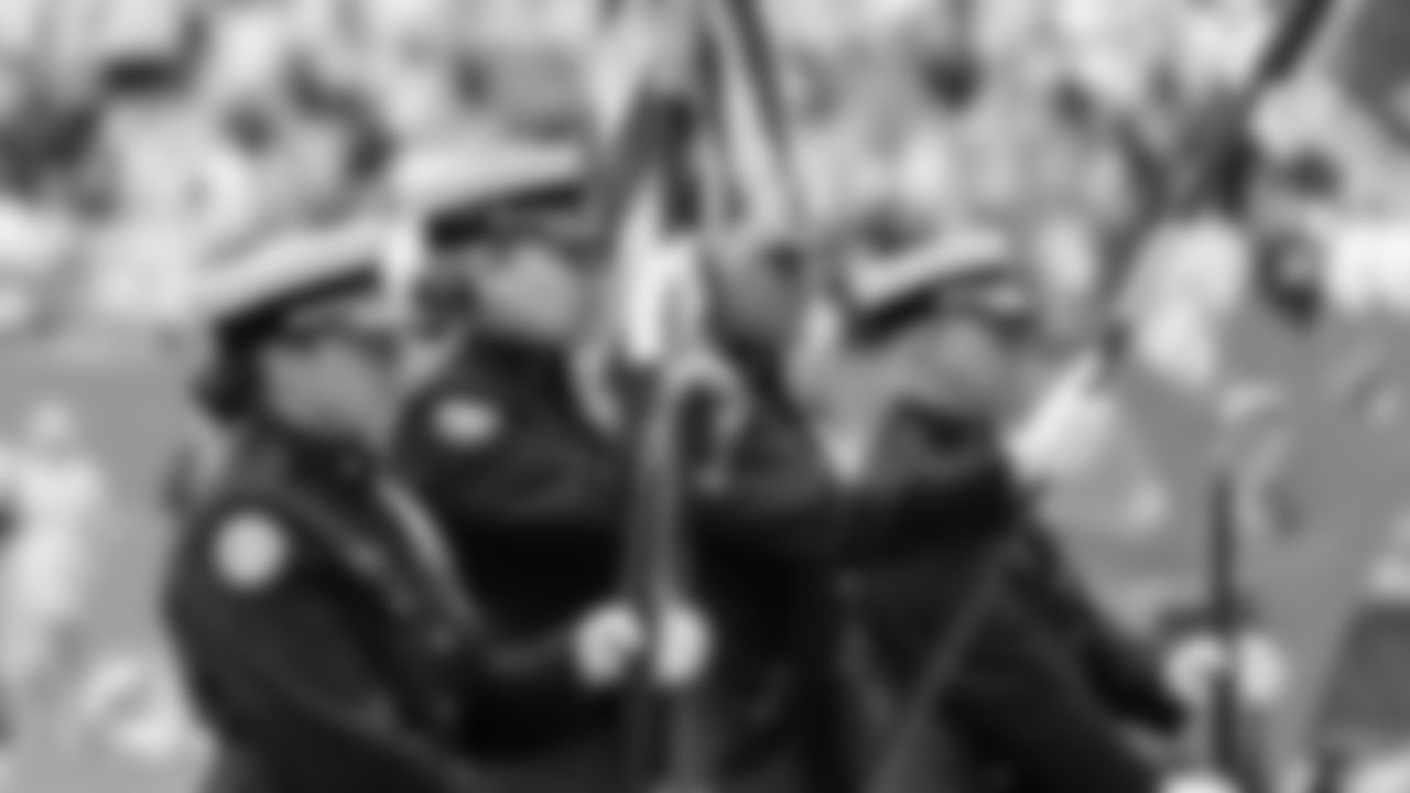 Color Guard stands for the National Anthem before an NFL football game against the New Orleans Saints on Sunday, Nov. 30, 2025 in Miami Gardens, FL. (Lauren Sopourn/Miami Dolphins via AP)