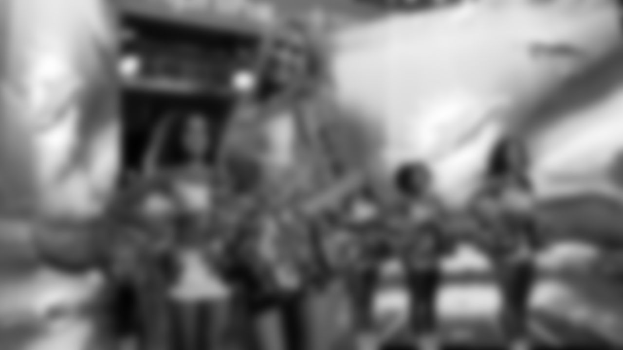 Miami Dolphins Cheerleaders exit the tunnel before an NFL football game against the Baltimore Ravens on Thursday, Oct. 30, 2025 in Miami Gardens, FL. (Jose Pineiro/Miami Dolphins via AP)