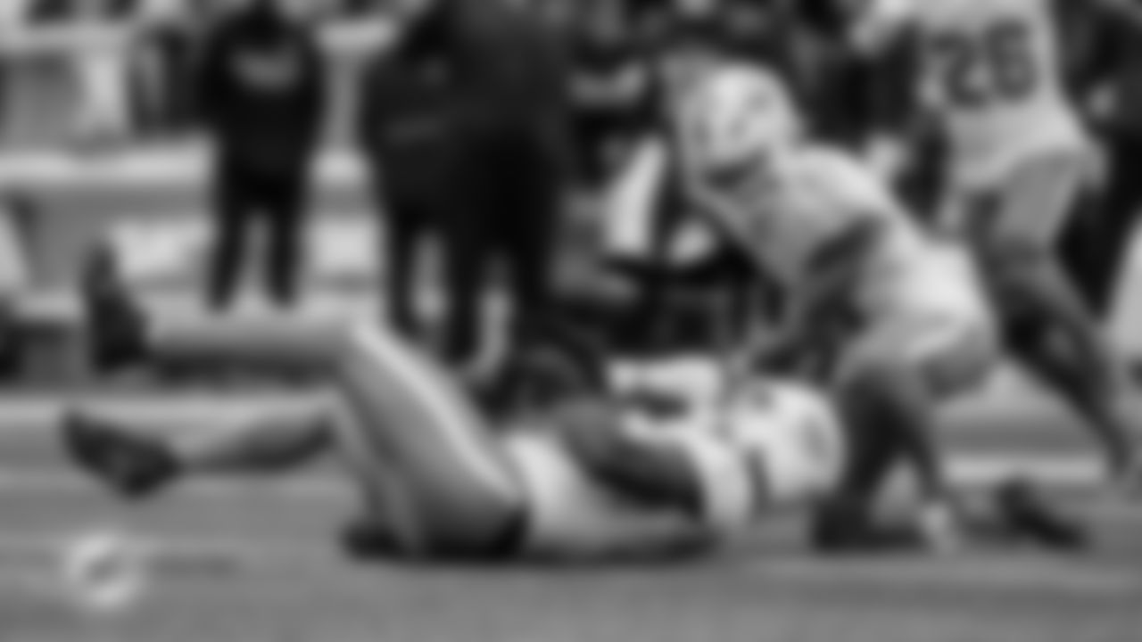 Miami Dolphins linebacker Tyrel Dodson (25) catches an interception between his knees during an NFL football game against the New York Jets on Sunday, Dec. 7, 2025 in East Rutherford, NJ. (Tomas Diniz Santos/Miami Dolphins via AP)