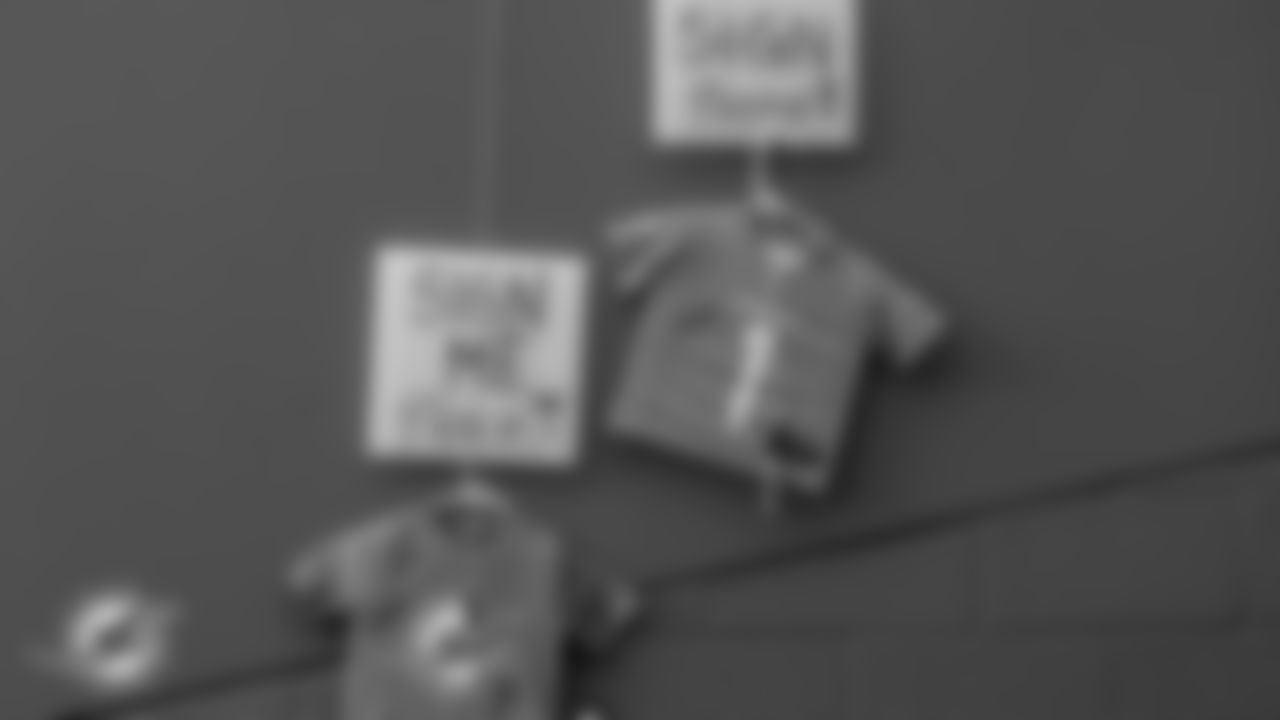 Miami Dolphins merch is hung down for autographs before an NFL football game against the Tampa Bay Buccaneers on Sunday, Dec. 28, 2025 in Miami Gardens, FL. (Jose Pineiro/Miami Dolphins via AP)