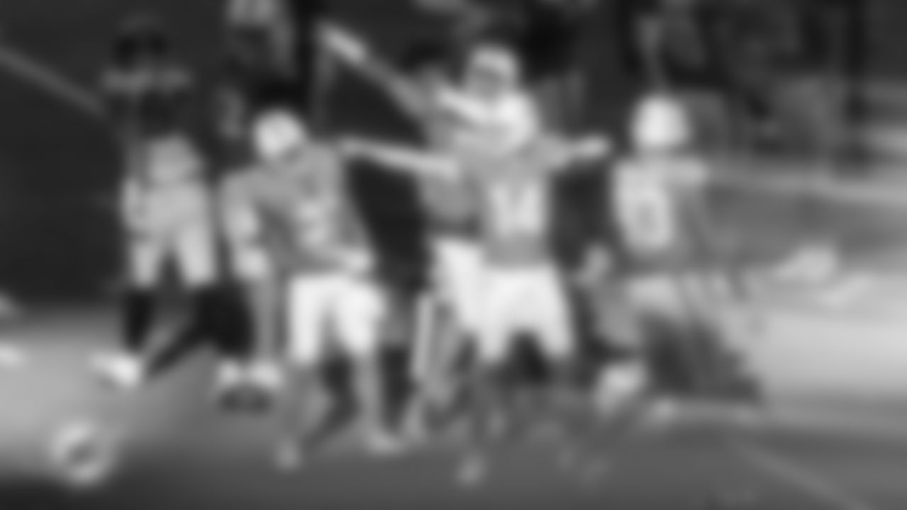 Miami Dolphins quarterback Quinn Ewers (14), offensive lineman Jonah Savaiinaea (72) and running back Ollie Gordon II (31) celebrate during an NFL football game against the Tampa Bay Buccaneers on Sunday, Dec. 28, 2025 in Miami Gardens, FL. (AJ Shorter/Miami Dolphins via AP)